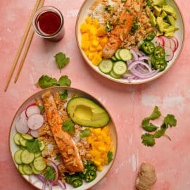 overhead shot of two salmon buddah bowls