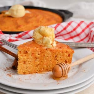 angled shot of slice of cornbread on plate