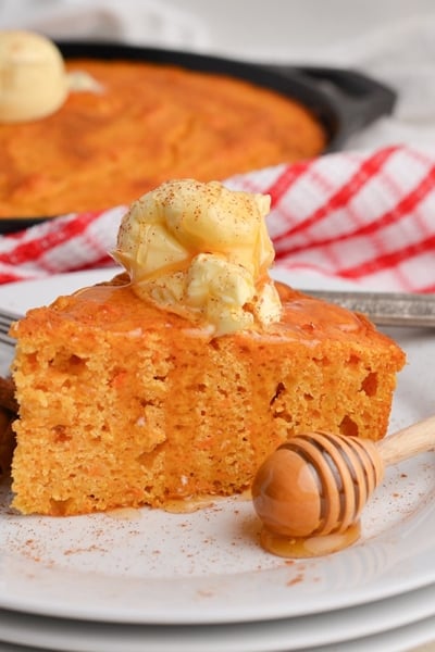 angled shot of slice of cornbread on plate