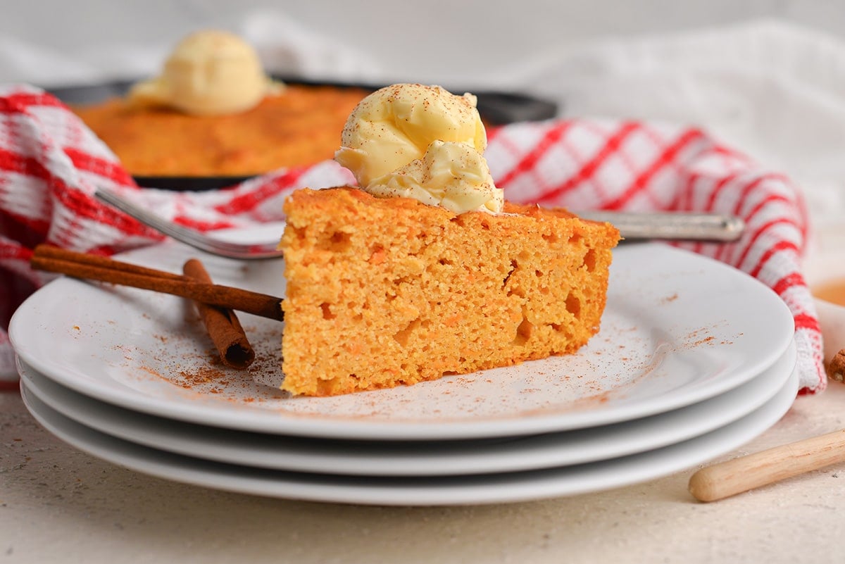 straight on shot of slice of cornbread on stack of plates