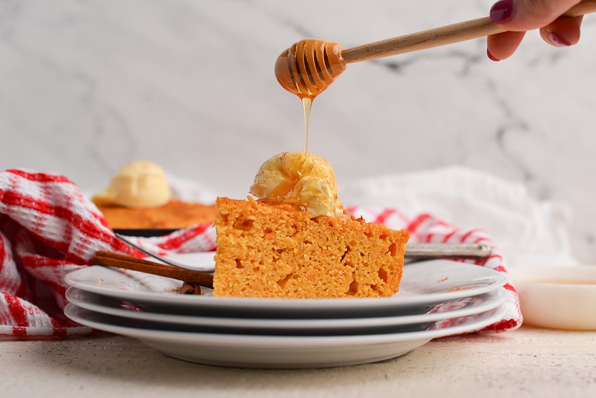 honey drizzled on slice of sweet potato cornbread