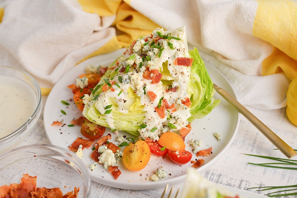 angled shot of wedge of iceberg topped with toppings