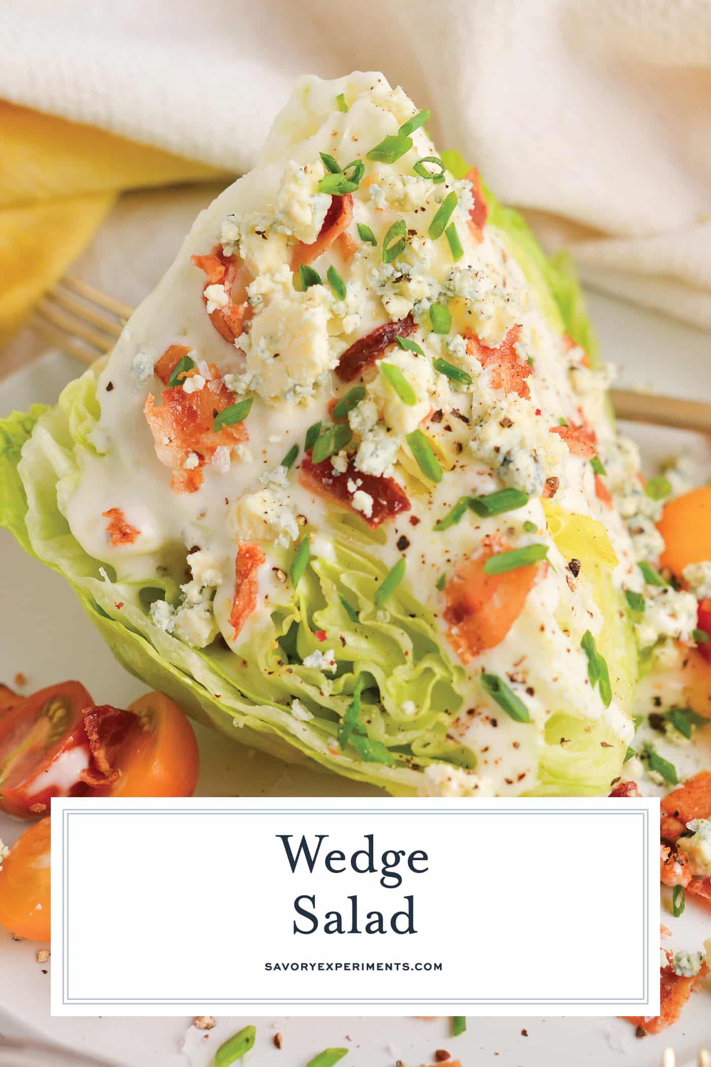 straight on shot of wedge salad on plate with text overlay for pinterest