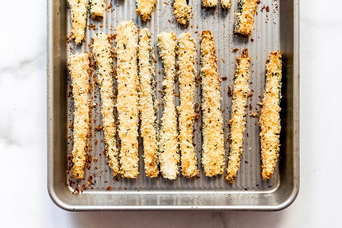 overhead shot of baking sheet of zucchini fries