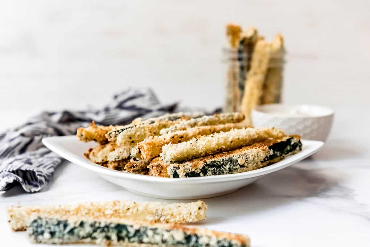 straight on shot of plate of baked zucchini fries