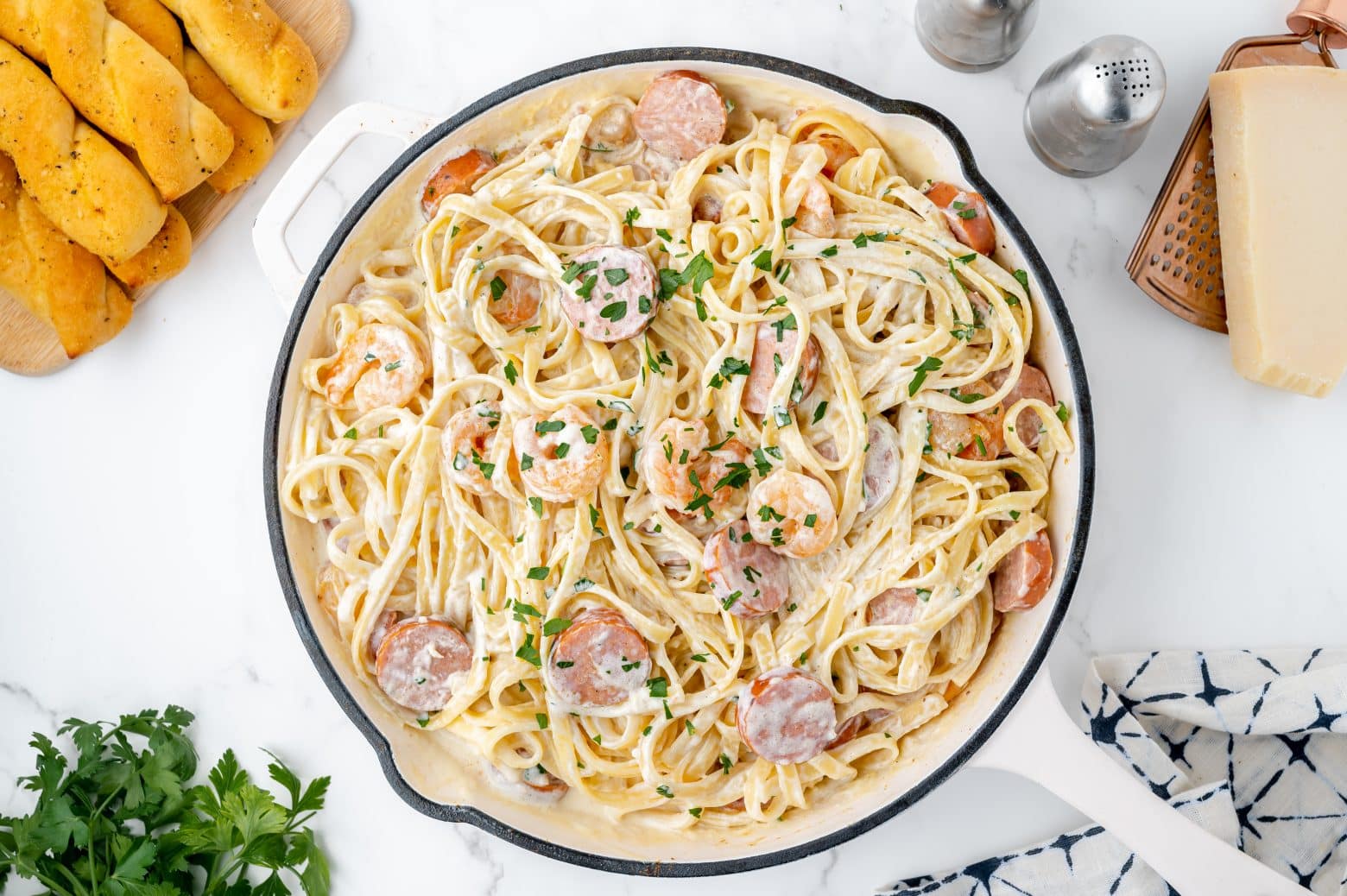 overhead of cajun shrimp alfredo in a cooking vessel