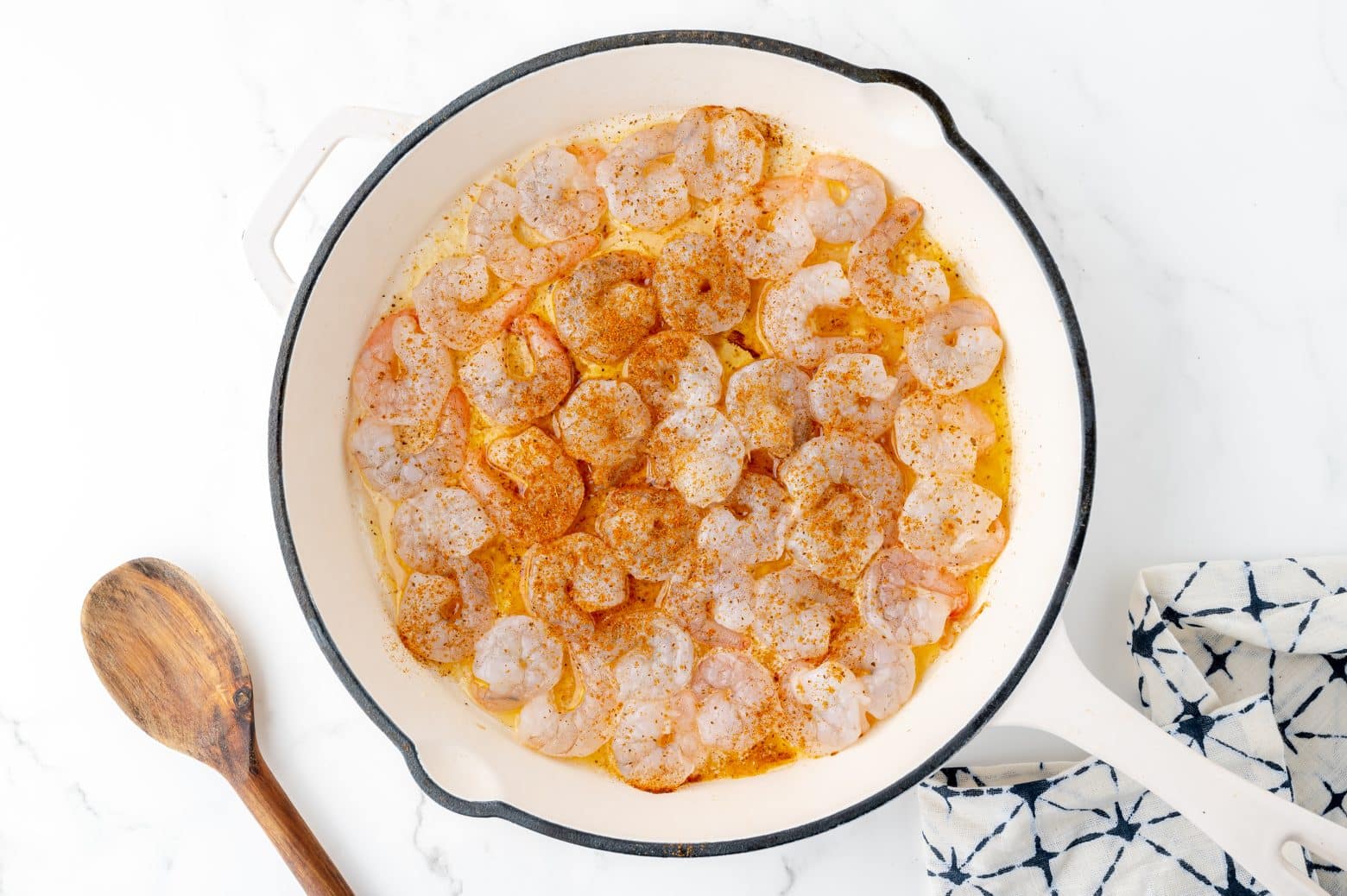 seasoned shrimp in a cast iron pan