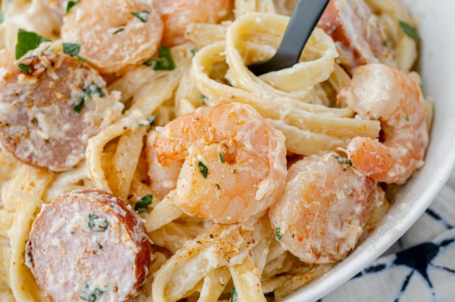 cajun shrimp alfredo on a fork