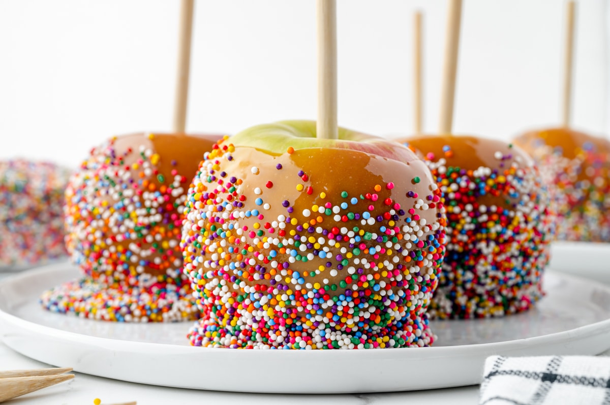 straight on shot of caramel apples on a plate