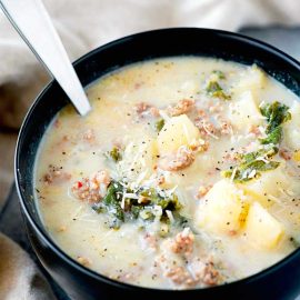 angled shot of crock pot zuppa toscana in bowl