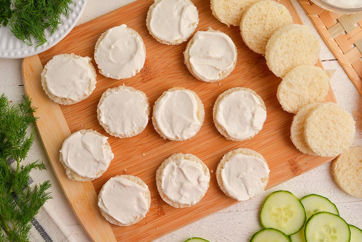 cream cheese spread onto round slices of bread