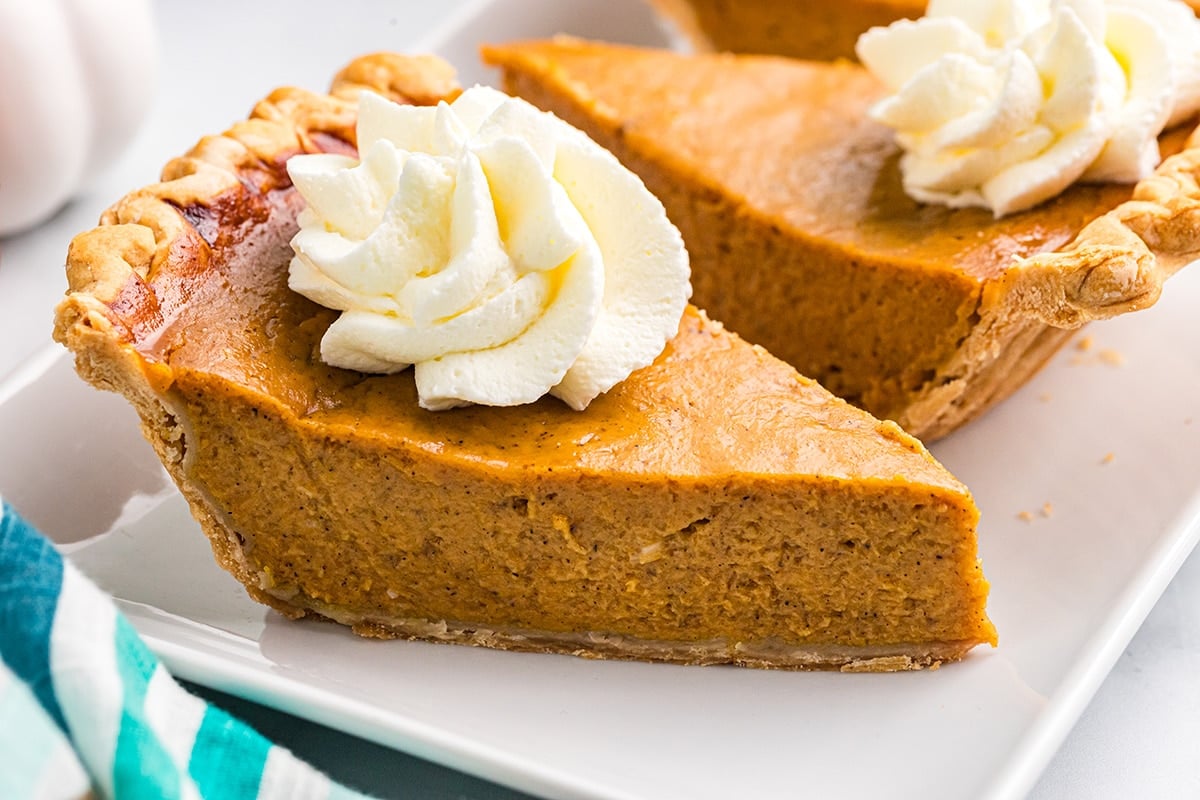 angled shot of two slices of pie on plate