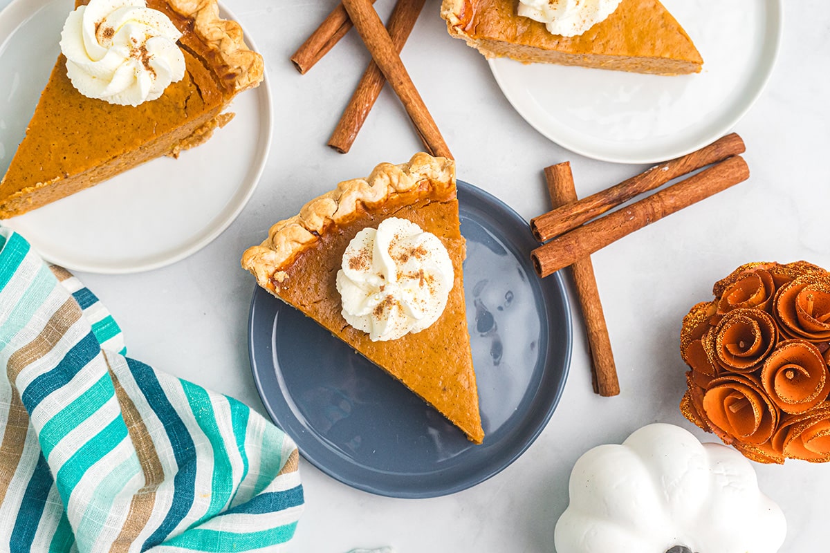 overhead shot of slice of pie on a blue plate