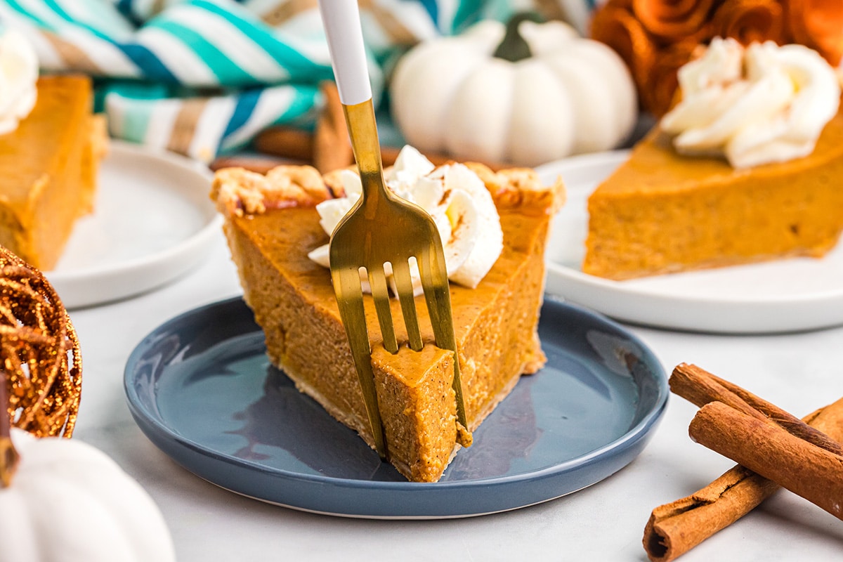 fork digging into slice of easy pumpkin pie