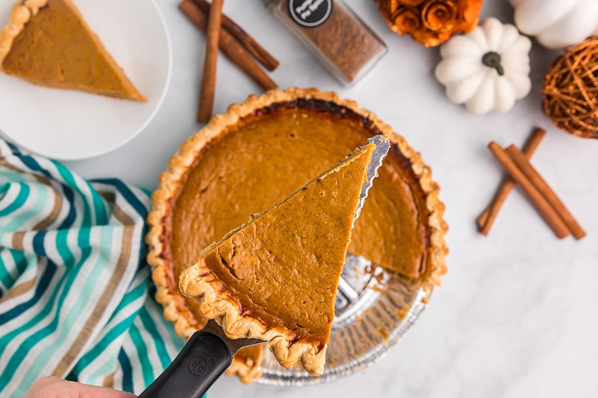 overhead shot of slice of easy pumpkin pie on spatula