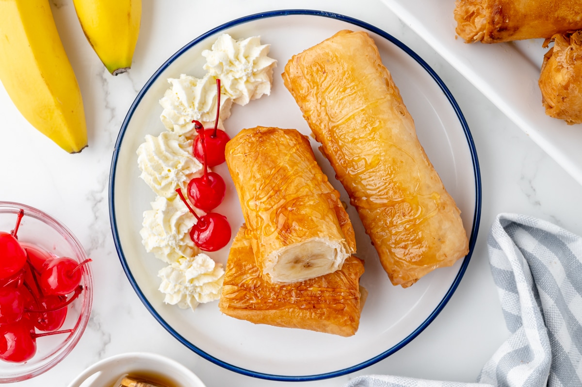 overhead shot of fried cheesecake on plate with whipped cream