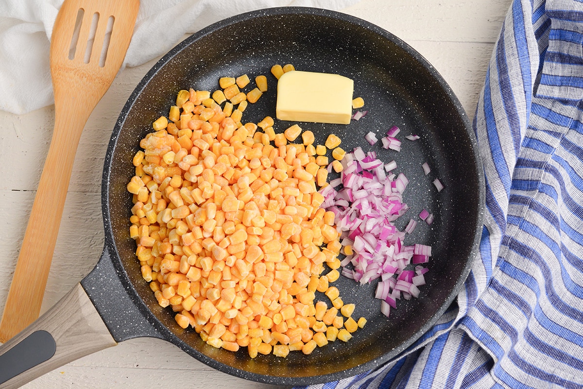 corn, onion and butter in pan