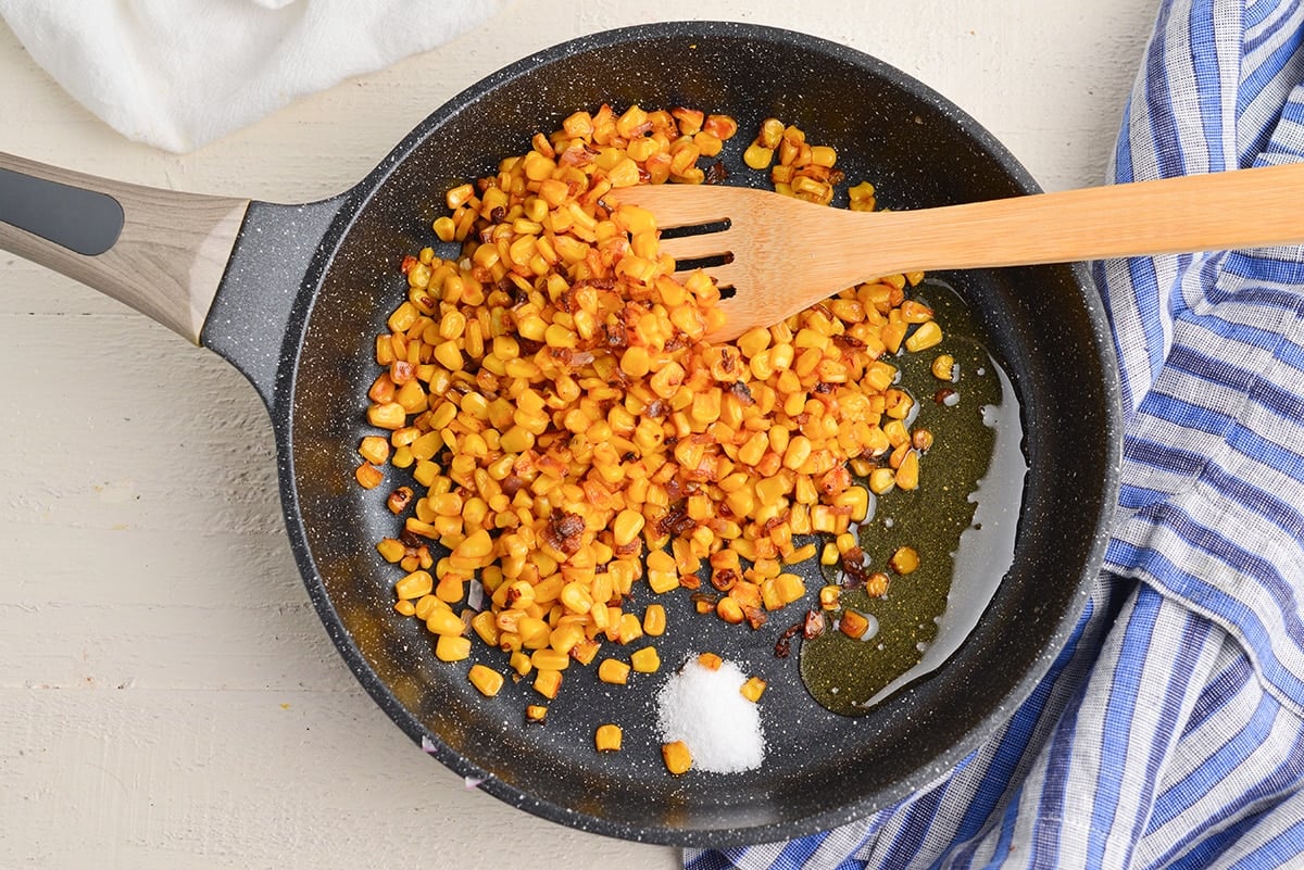corn sautéing in pan with agave