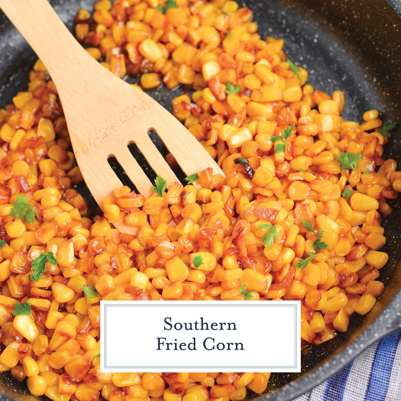wooden spoon in pan of southern fried corn with text overlay for facebook