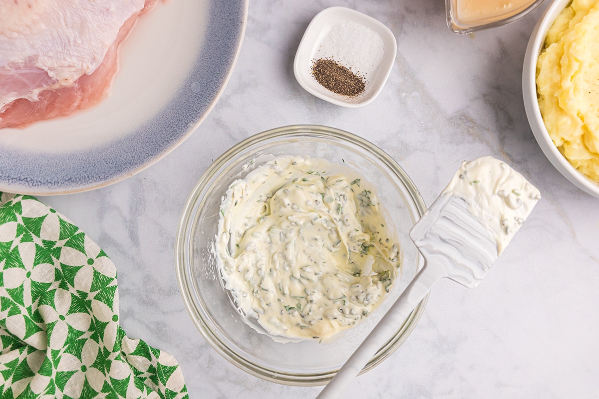 overhead shot of herb mayo in a bowl