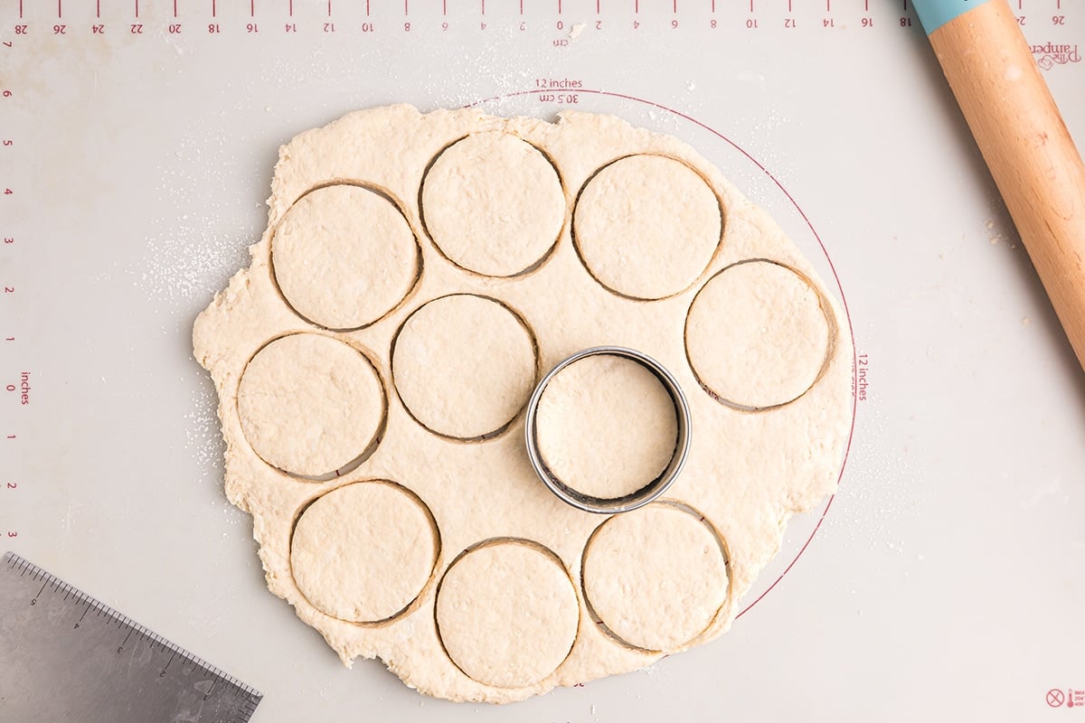 cutting out biscuits on a rolling mat