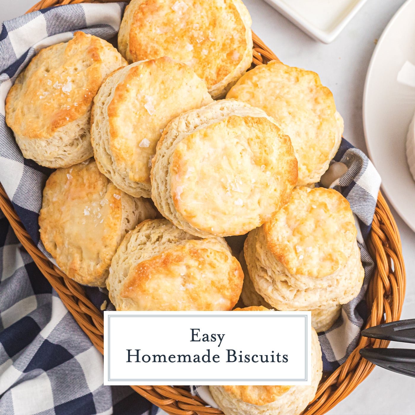 Overhead of biscuits in a basket with text overlay saying "easy homemade biscuits"