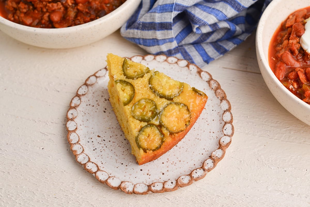 angled shot of slice of cornbread on plate