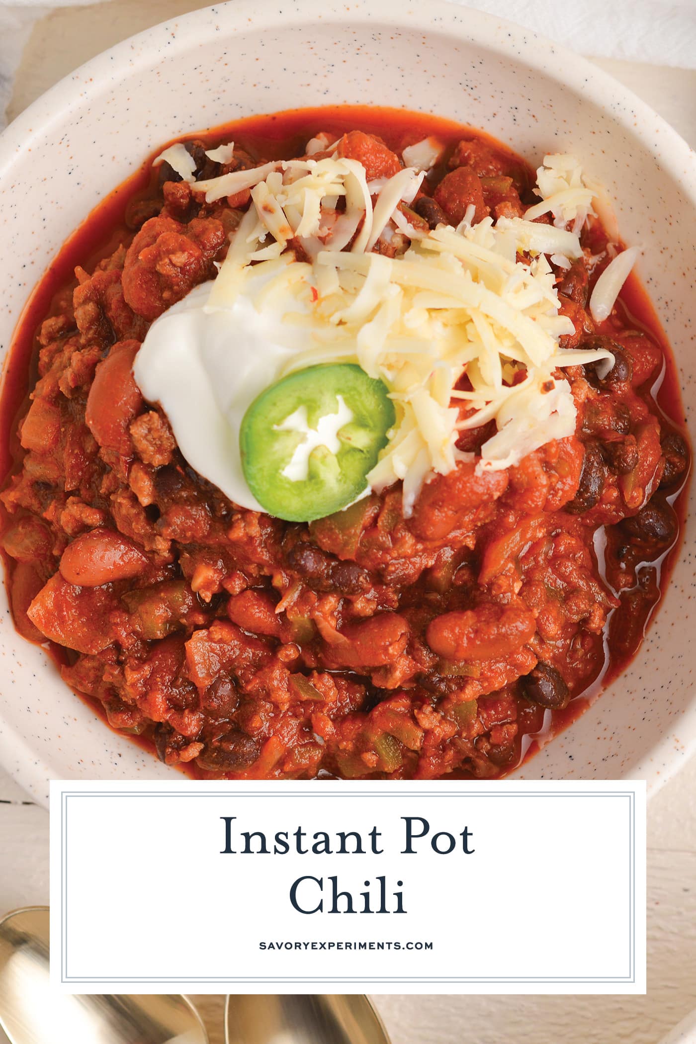 overhead shot of bowl of instant pot chili with text overlay for pinterest