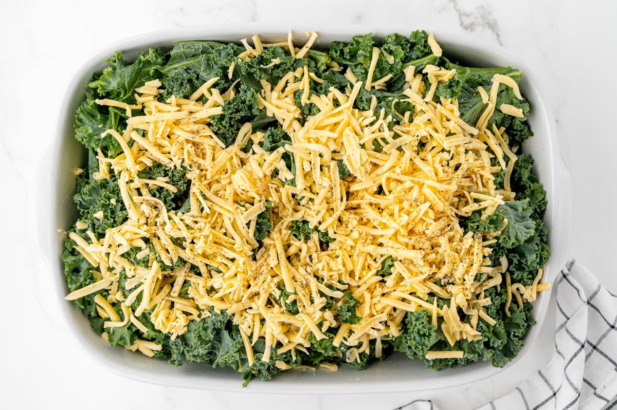 cheese sprinkled over raw kale