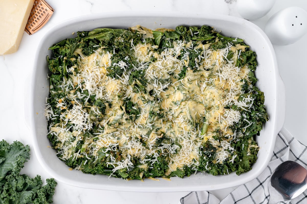 freshly grated cheese on kale gratin