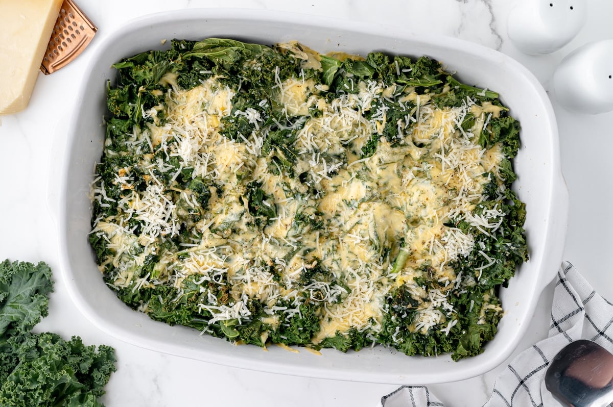 angled overhead shot of pan of baked kale gratin