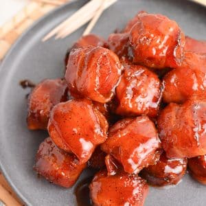 close up angled shot of kielbasa bites on a plate