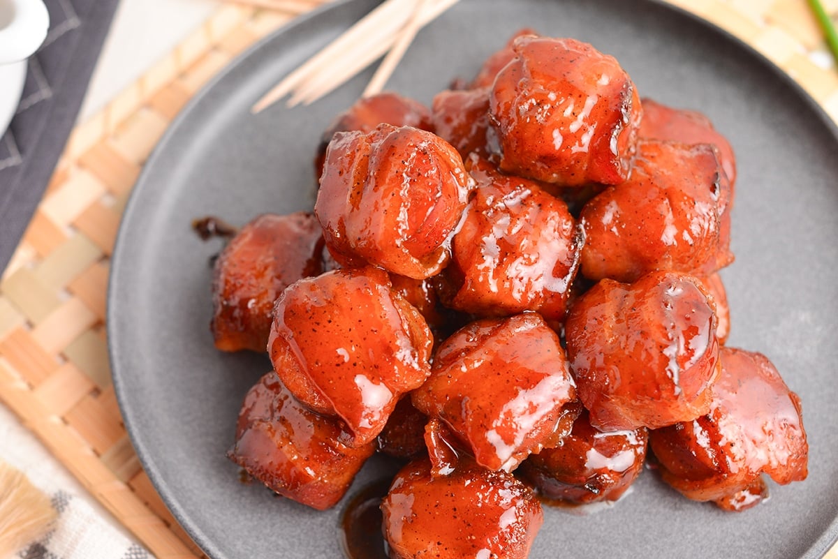 close up angled shot of kielbasa bites on a plate