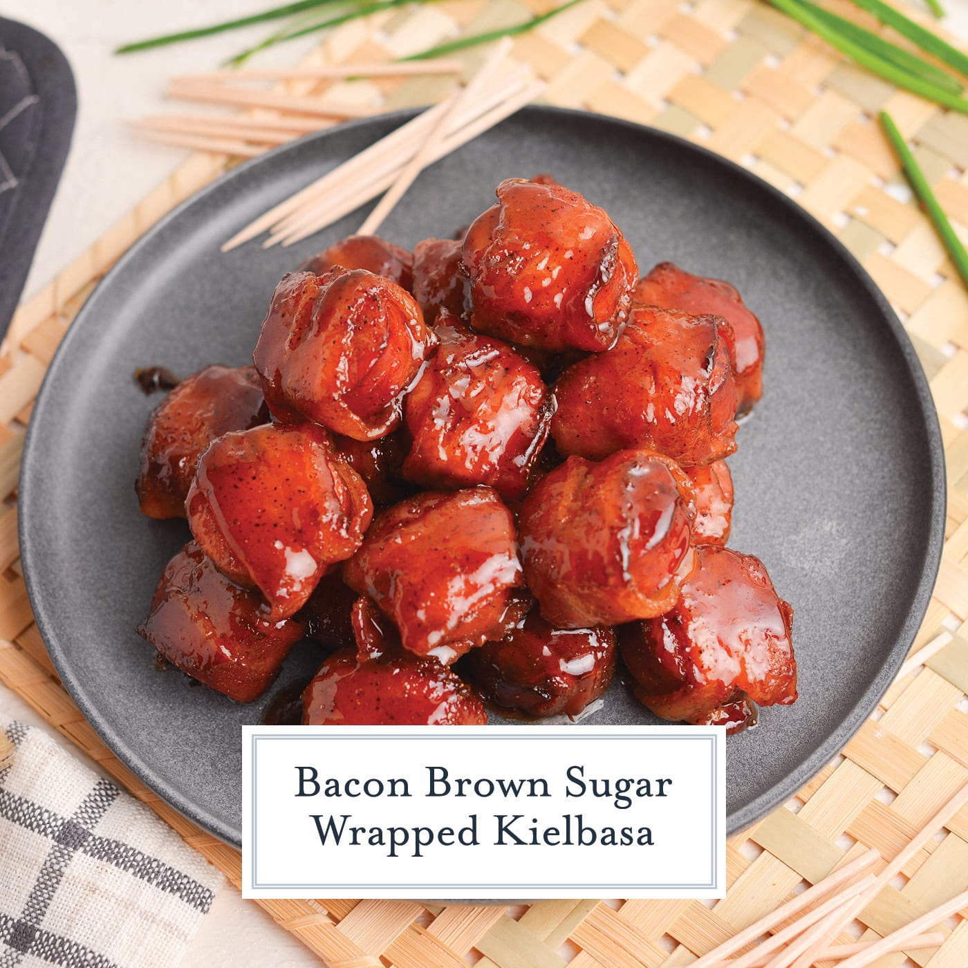 angled shot of plate of brown sugar bacon wrapped kielbasa bites with text overlay for facebook