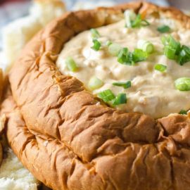 angled shot of lobster dip in bread bowl