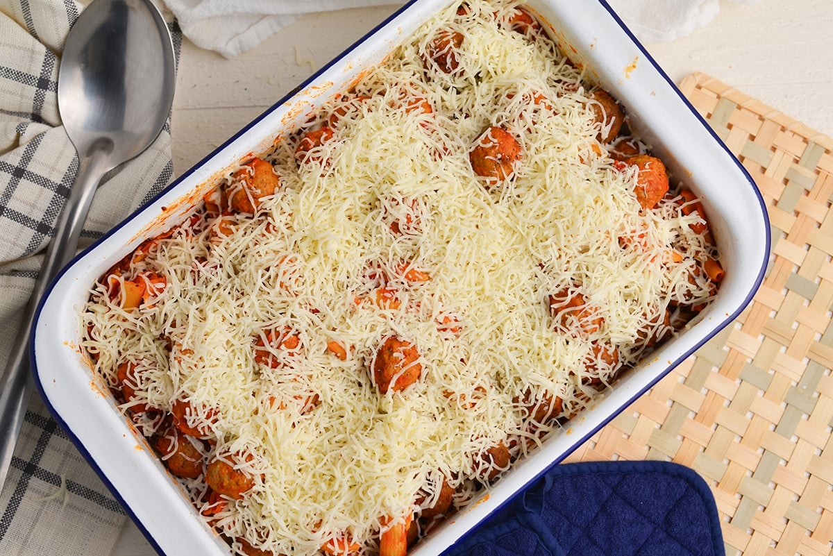 shredded cheese on meatball casserole