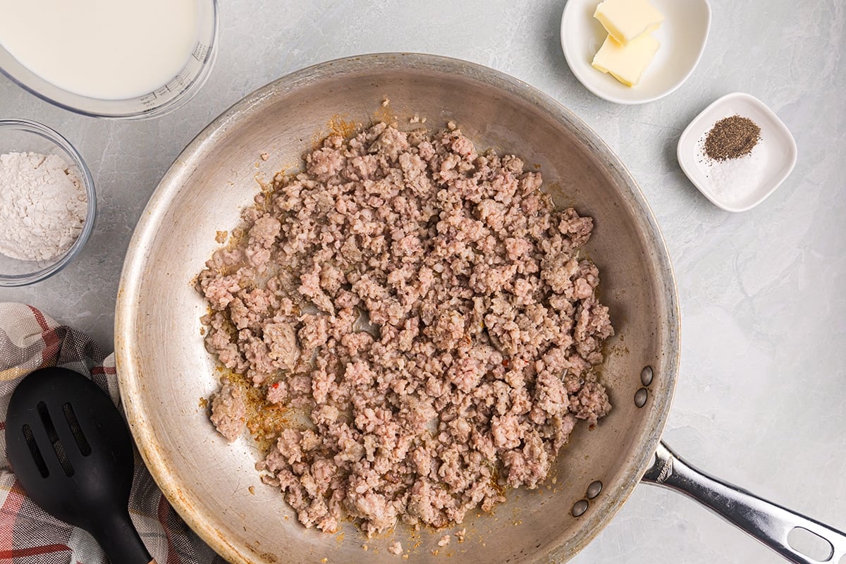 sausage cooking in a pan