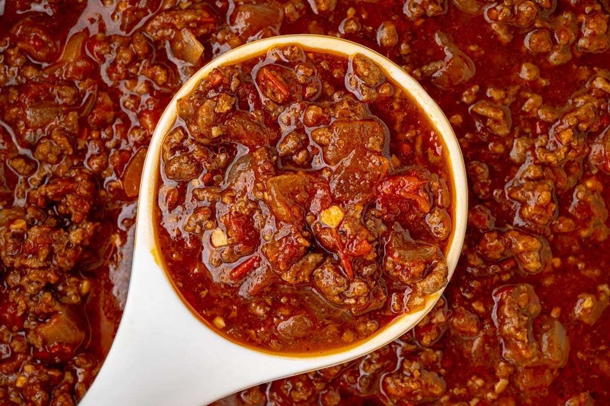 overhead shot of ladle in pot of skyline chili