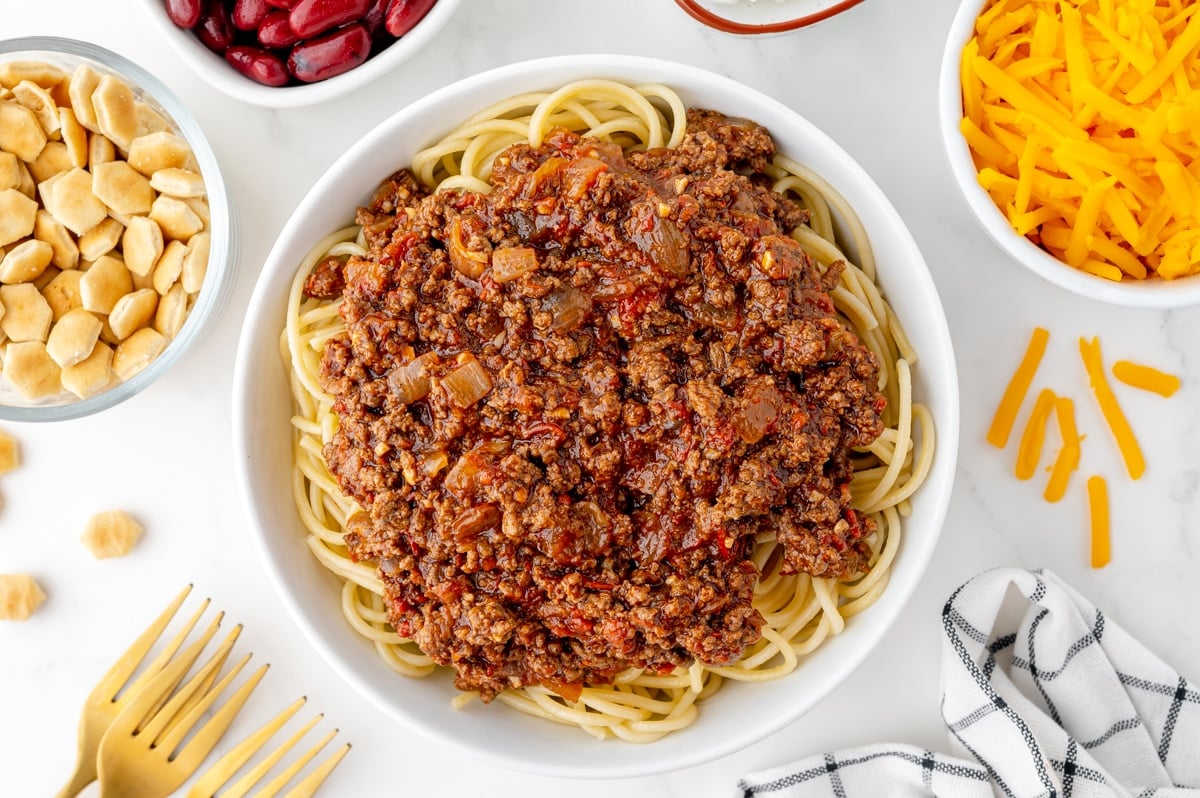 overhead shot of skyline chili over bowl of pasta