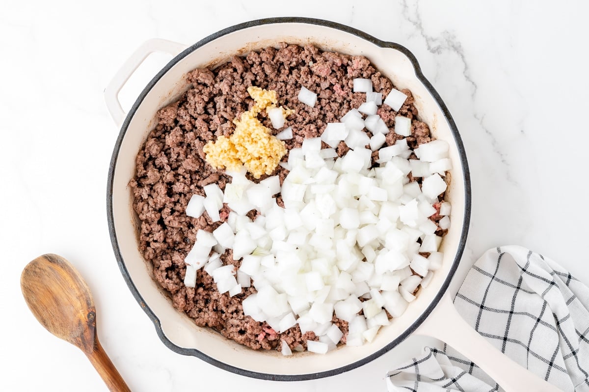 onions and garlic in pan of ground beef