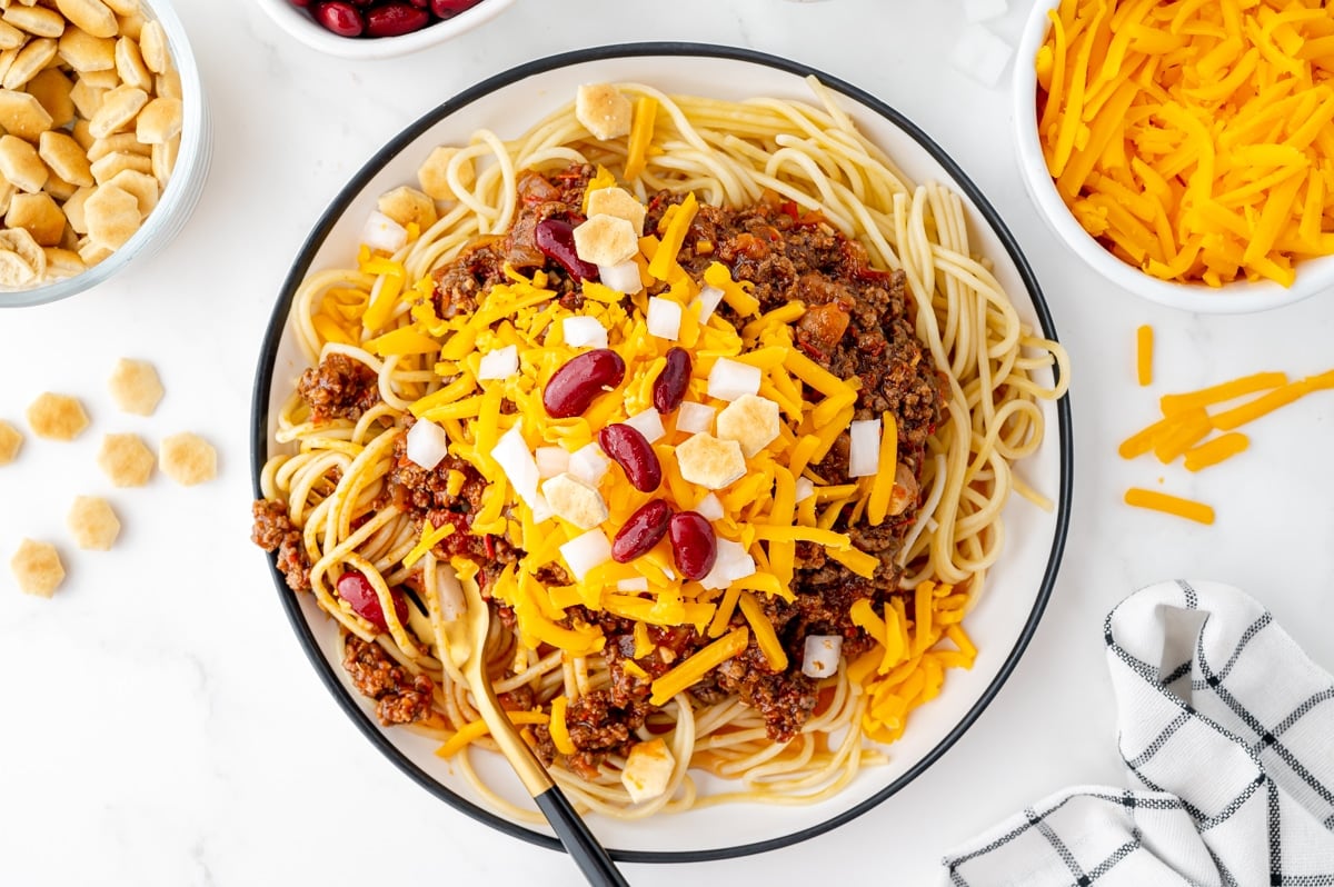overhead shot of cincinnati chili in bowl with fork