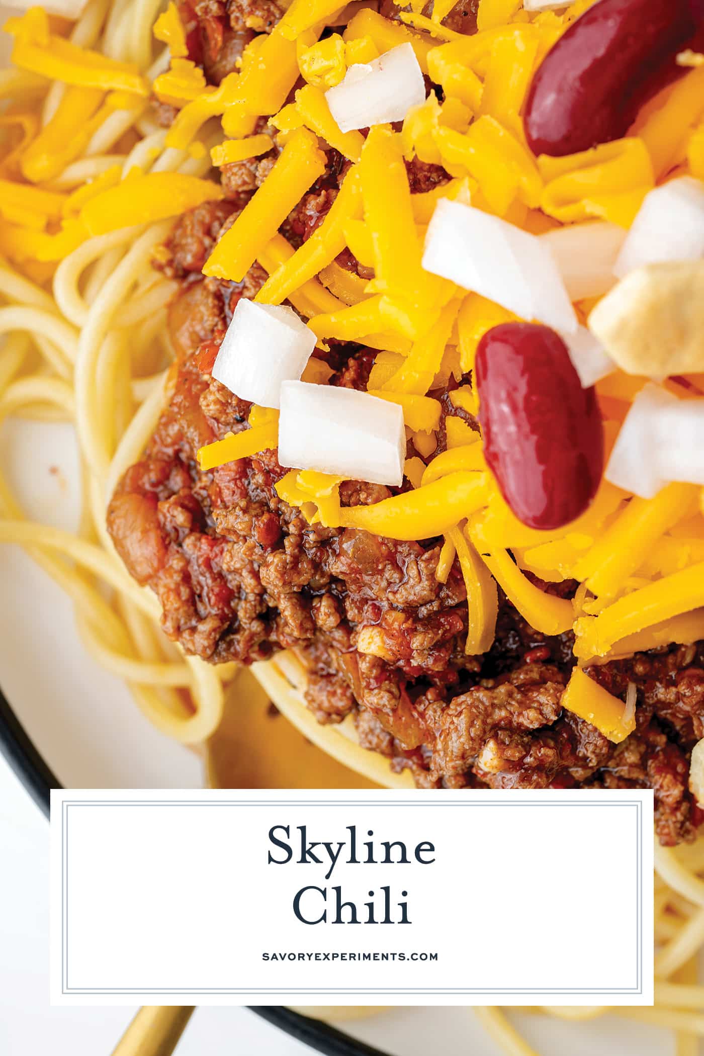 close up of fork in bowl of skyline chili with text overlay for pinterest