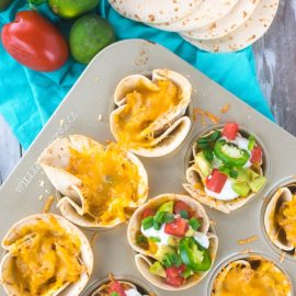 overhead shot of pan of shredded chicken taco cups