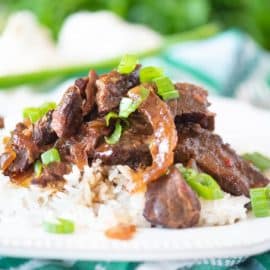 straight on shot of plate of mongolian beef over rice