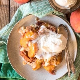 overhead shot of plate of slow cooker peach cobbler cake