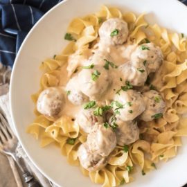 overhead shot of bowl of swedish meatballs over noodles