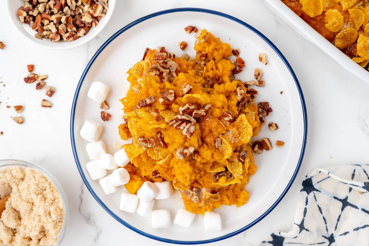 sweet potato casserole serving on a white plate