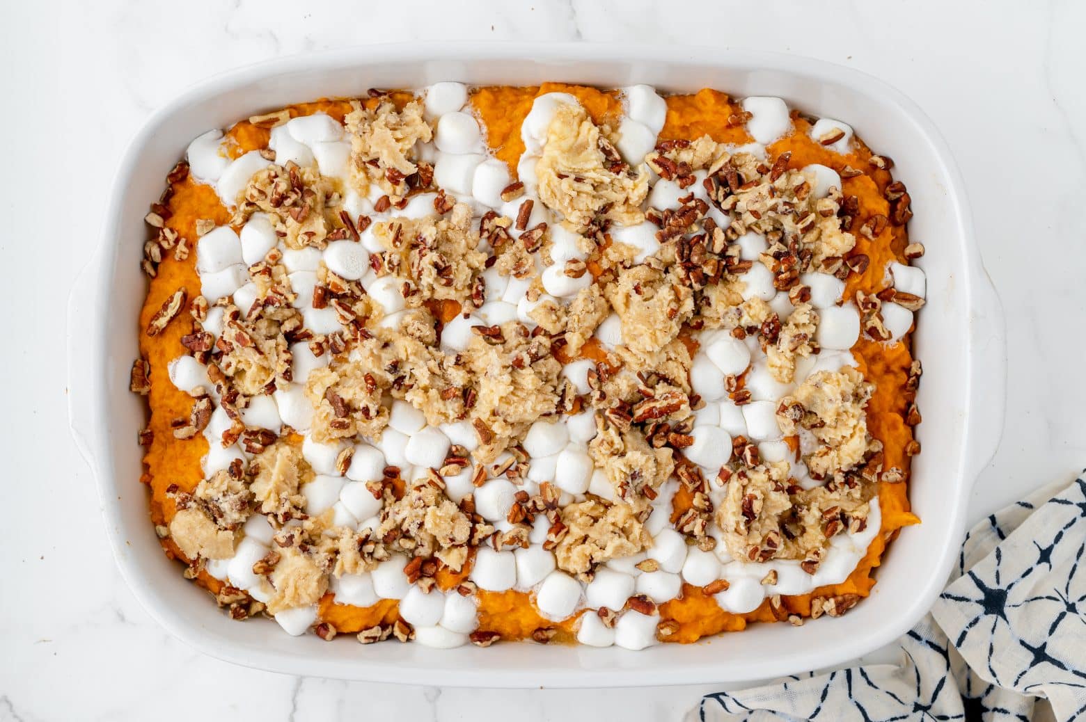 marshmallows and pecan topping on sweet potato casserole recipe