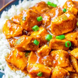 angled shot of plate of crock pot bourbon chicken