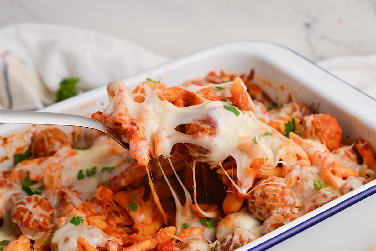 serving a pasta dish with meatballs